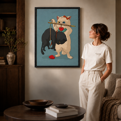 a black-framed whimsical cat canvas print above a console