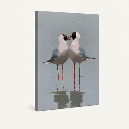 Gallery wrapped canvas print of two seagulls beak to beak with water reflection on soft grey-blue background, angled 3D view