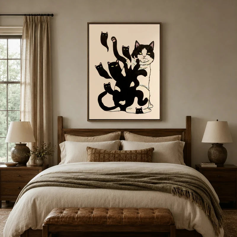 Bold tuxedo cat minimalist canvas wall art above linen bed in cozy neutral bedroom with wood headboard and table lamps