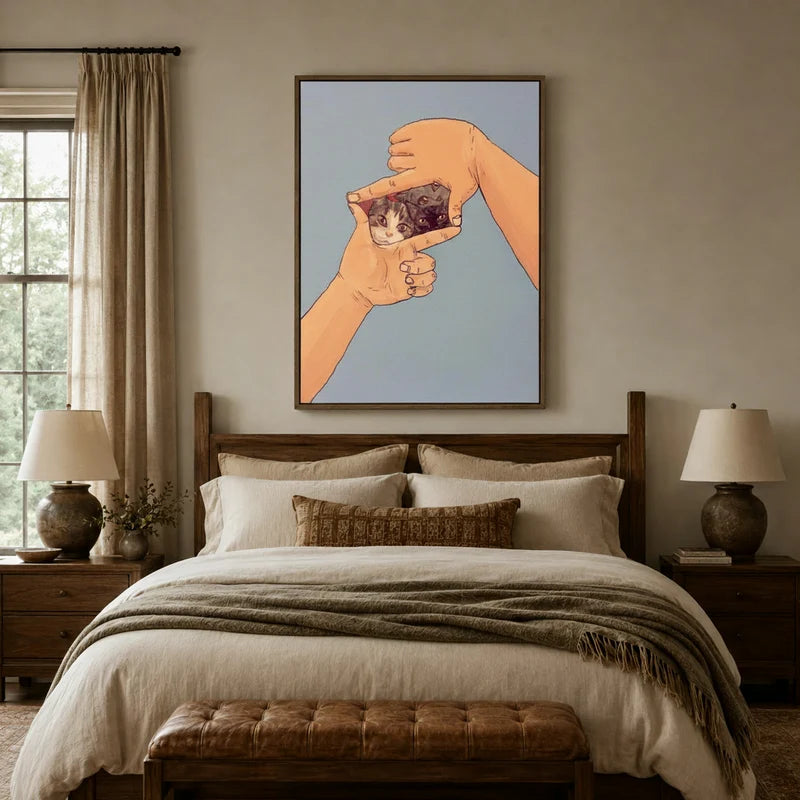 Playful two cats finger-frame canvas wall art above linen bed in cozy neutral bedroom with wood headboard