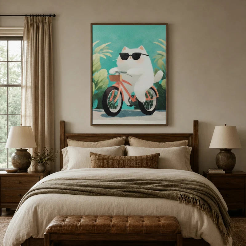 Cute cat canvas wall art above a bed in a cozy neutral bedroom with warm lamp lighting