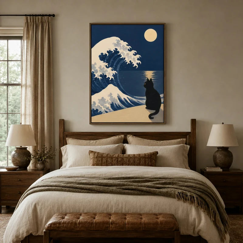 Black cat and moonlit wave canvas wall art hanging above bed in cozy neutral bedroom