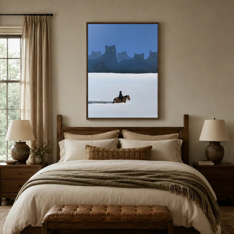 Dark whimsical cowboy and giant cats canvas displayed above a wooden bed in a warm traditional bedroom