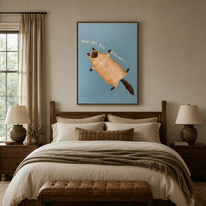 Whimsical Siamese cat wall art above bed in cozy neutral bedroom with warm linen tones