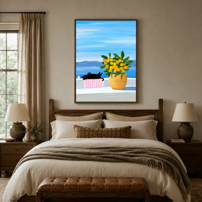 Bright Mediterranean cat canvas art hanging in a styled bedroom with blue and warm neutral tones