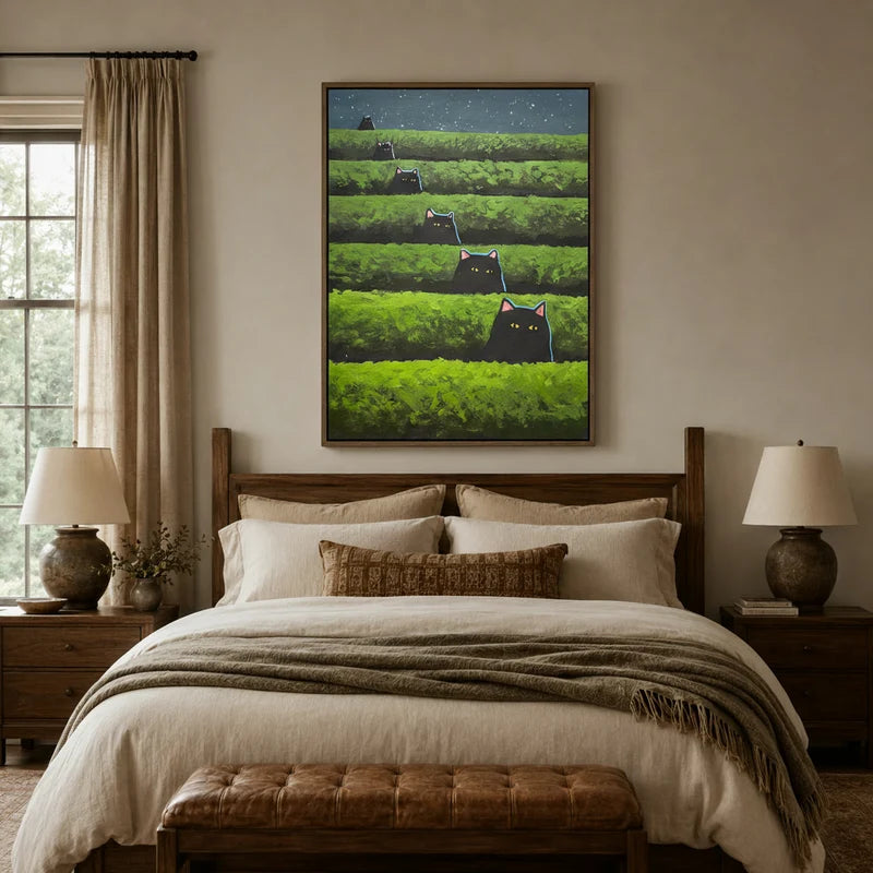 Whimsical black cat tea field canvas displayed above a cozy neutral bedroom headboard