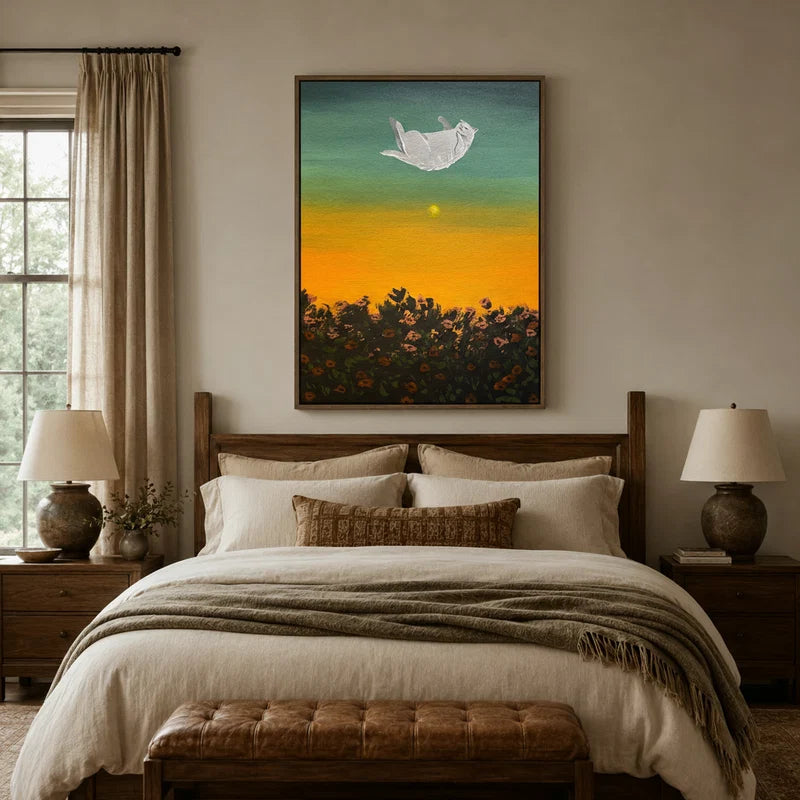 Dreamy sunset cat canvas art hanging in a styled bedroom with warm amber and teal tones