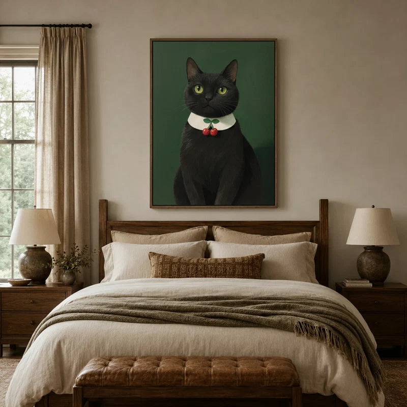 Black cat cherry collar portrait canvas above wooden bed in a rustic bedroom with linen bedding and leather bench