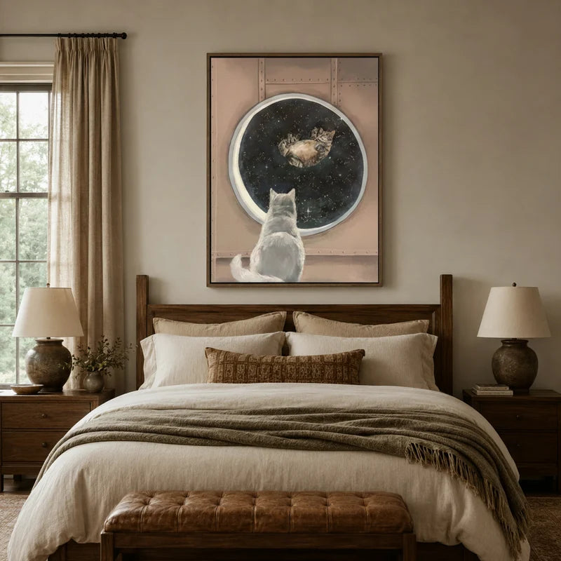 Dreamy cat stargazing canvas art above a linen bed in a warm neutral bedroom