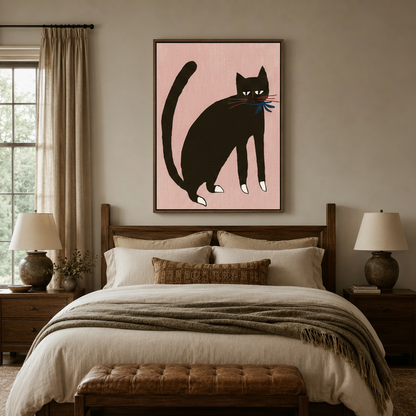 Black cat canvas print in dark walnut frame above wooden bed in cozy neutral bedroom