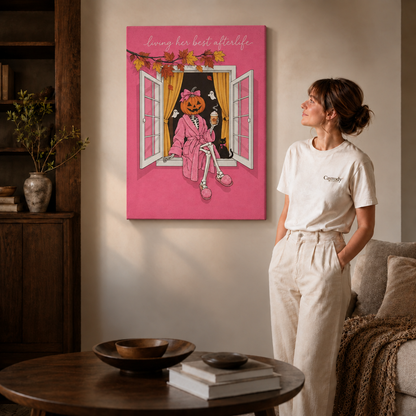 Gallery wrapped canvas of a pumpkin headed skeleton sipping coffee by an open window with yellow curtains.