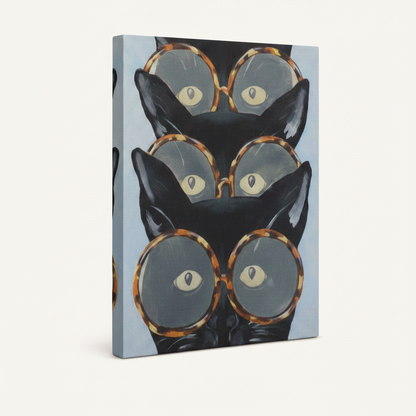 Gallery wrapped canvas of bold black cats in round glasses, no frame, angled product view