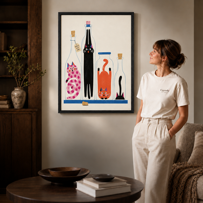 Black-framed cats in bottles canvas wall art in a softly lit living room.