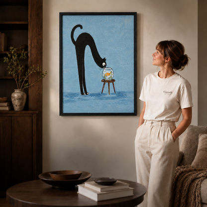 Black framed cat and goldfish canvas wall art styled in a warm modern living room