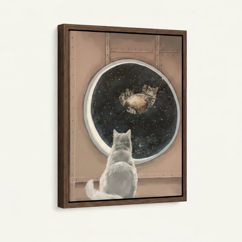 White cat gazing through starry porthole — floater framed canvas wall art close-up view