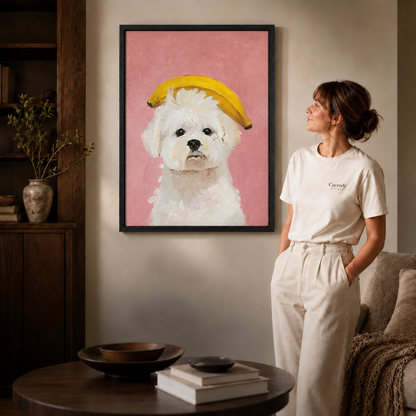 Banana dog artwork on a pink background in a slim black frame beside a woman.