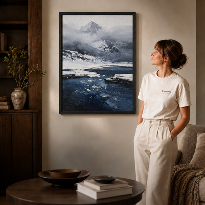 Black framed winter mountain lake wall art styled in a warm modern living room