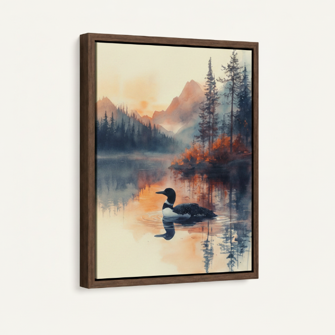 Framed loon sunset watercolor canvas print with dark walnut floating frame on clean cream background
