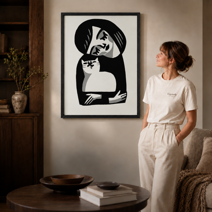 Black framed woman hugging a cat wall art styled in a warm modern living room