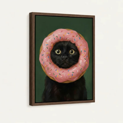 Close-up of black cat donut portrait in walnut floater frame, angled product shot on white background