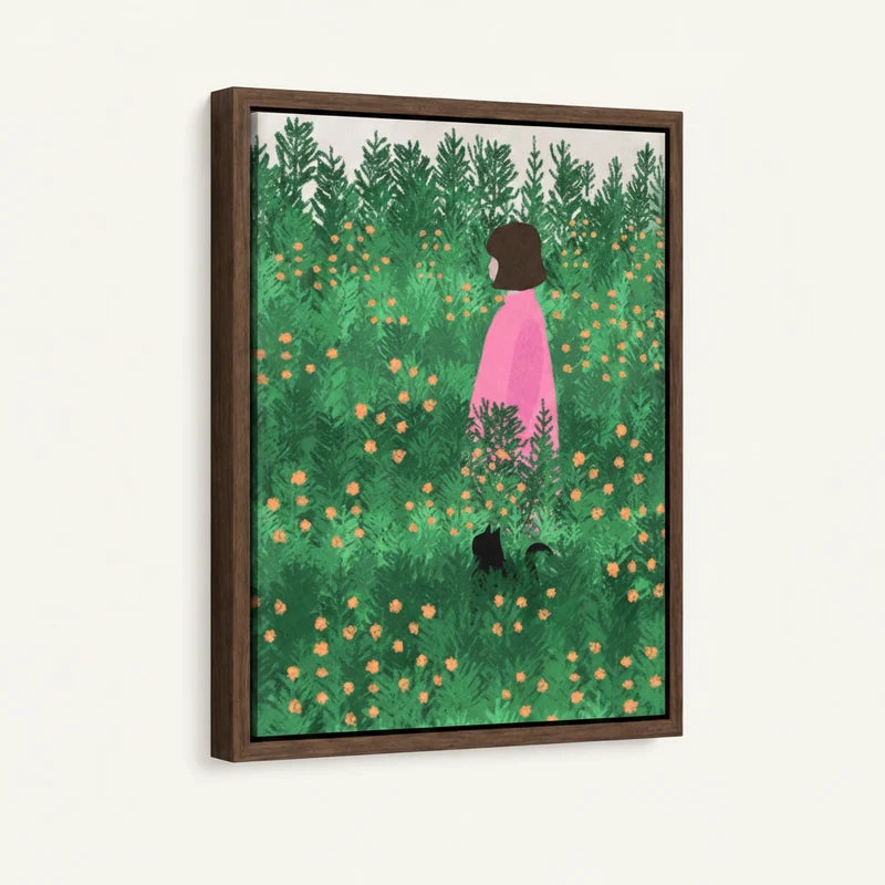 Framed canvas close-up of girl in pink and black cat standing in lush green wildflower meadow