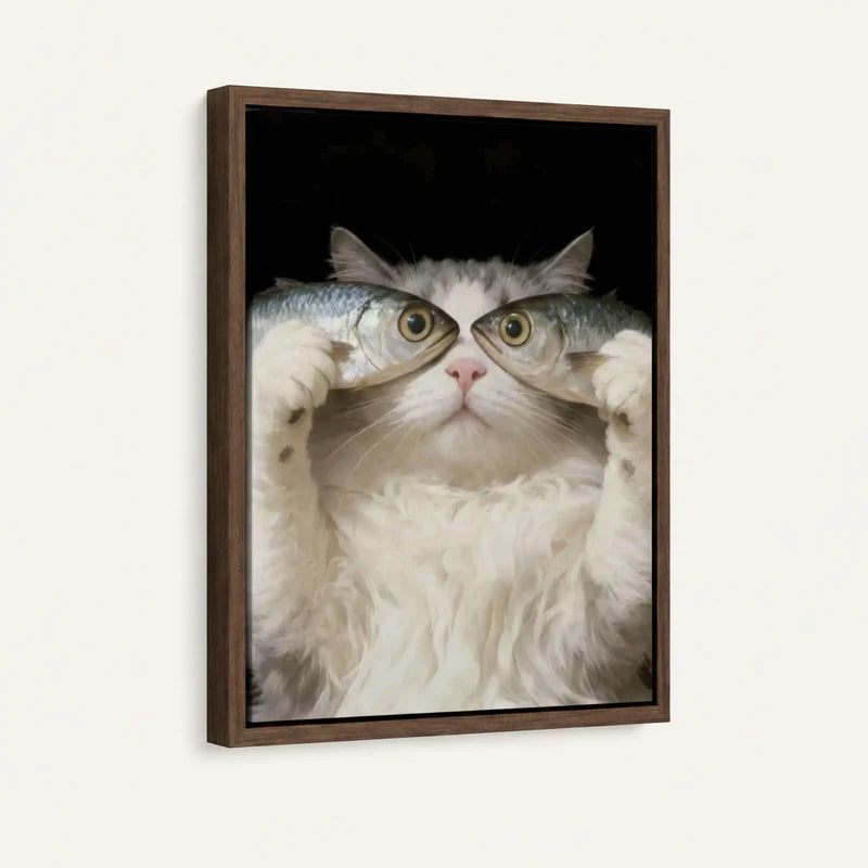 Floater-framed canvas angled view of white fluffy cat holding two fish over eyes on deep black background