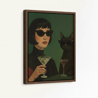 Framed canvas close-up of retro woman in cat-eye sunglasses and black cat holding martini glasses