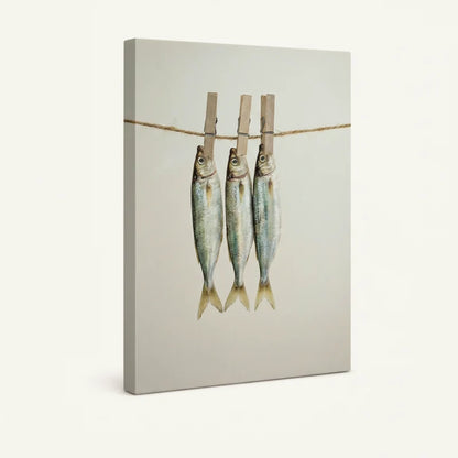 Gallery-wrapped three fish on clothesline canvas print shown as standalone product on cream background