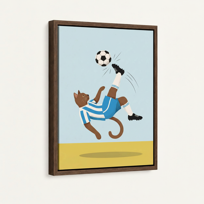 Framed canvas close-up of cat in blue jersey performing a bicycle kick on sky-blue background