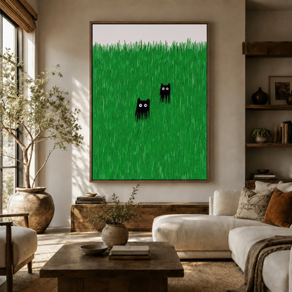 Large black cat canvas art hanging in a bright modern living room above wooden sideboard