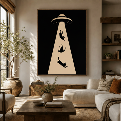 Bold UFO cat abduction pop art canvas in dark frame hung in warm Japandi-style living room