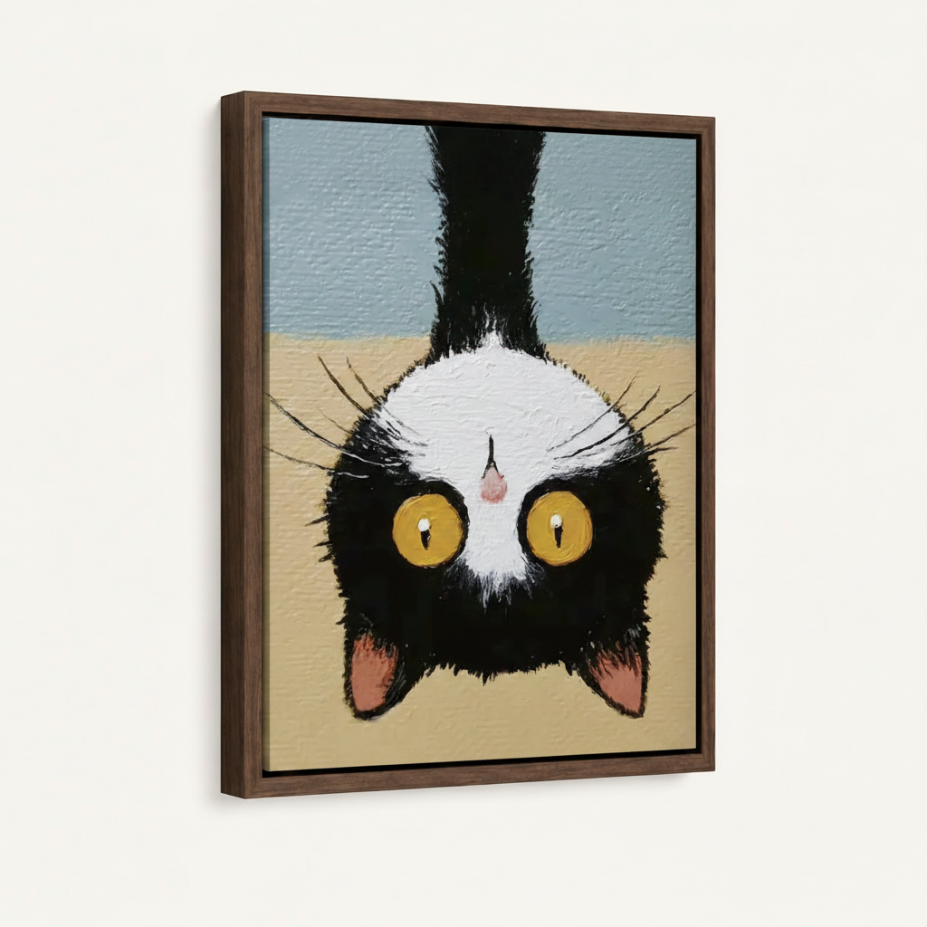 Angled close-up of upside-down cat canvas in walnut floater frame showing thick textured brushwork
