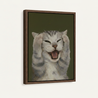 Close-up of framed funny cat canvas showing walnut floater frame detail and expressive tabby portrait