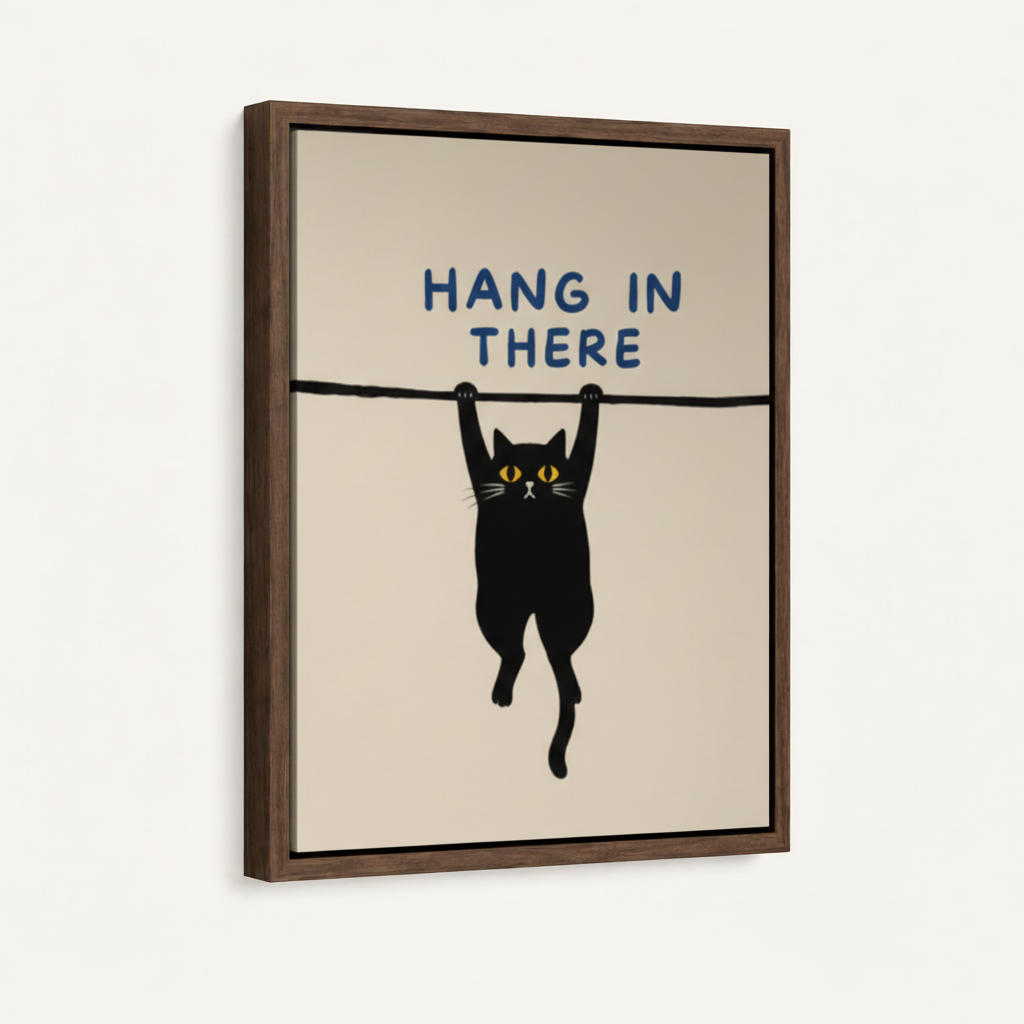 Framed canvas version of Hang In There cat print with walnut wood frame on a clean white wall