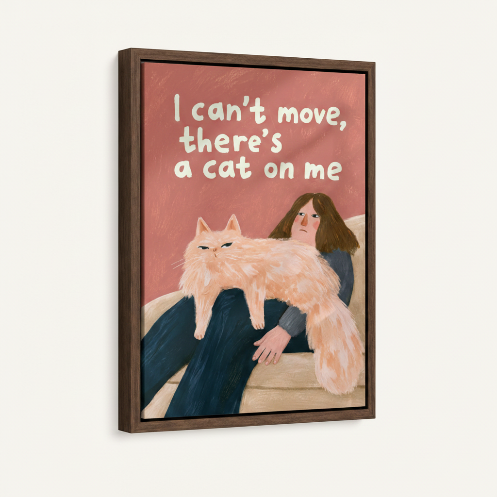 Framed funny cat canvas print showing woman stuck under fluffy cat on sofa