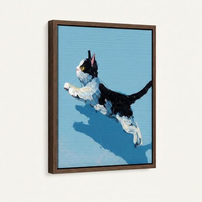 Leaping tuxedo cat impasto canvas in dark walnut floater frame, angled product view on white background