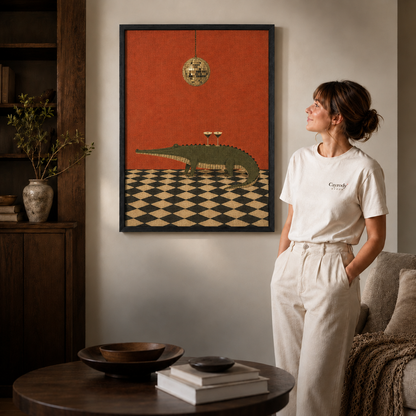 Playful crocodile canvas wall art in a cozy living room with black framing, shelving, sofa, and coffee table.