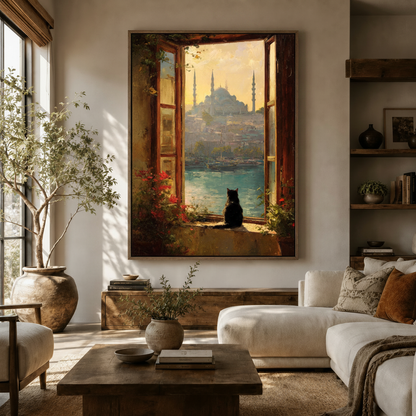 Large framed Istanbul cat canvas print on living room wall above white sofa with warm natural light