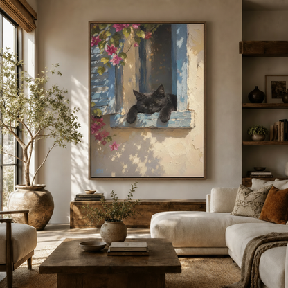 Sleeping cat French window framed canvas hung above sofa in bright boho living room with natural light