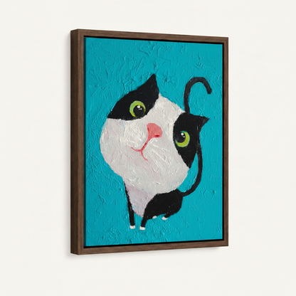 Cute cat canvas wall art in dark walnut floater frame displayed at angle on clean white background