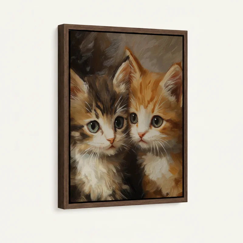 Framed two kittens canvas wall art with walnut frame leaning against white wall