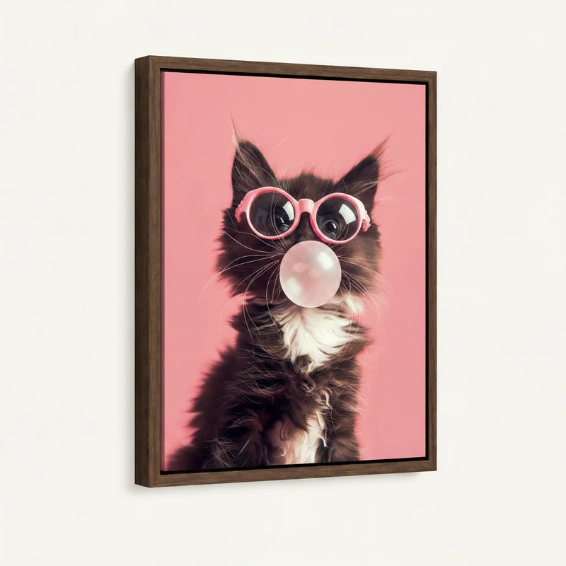 Framed black kitten in pink sunglasses pop art canvas print with walnut frame shown at angle against white wall