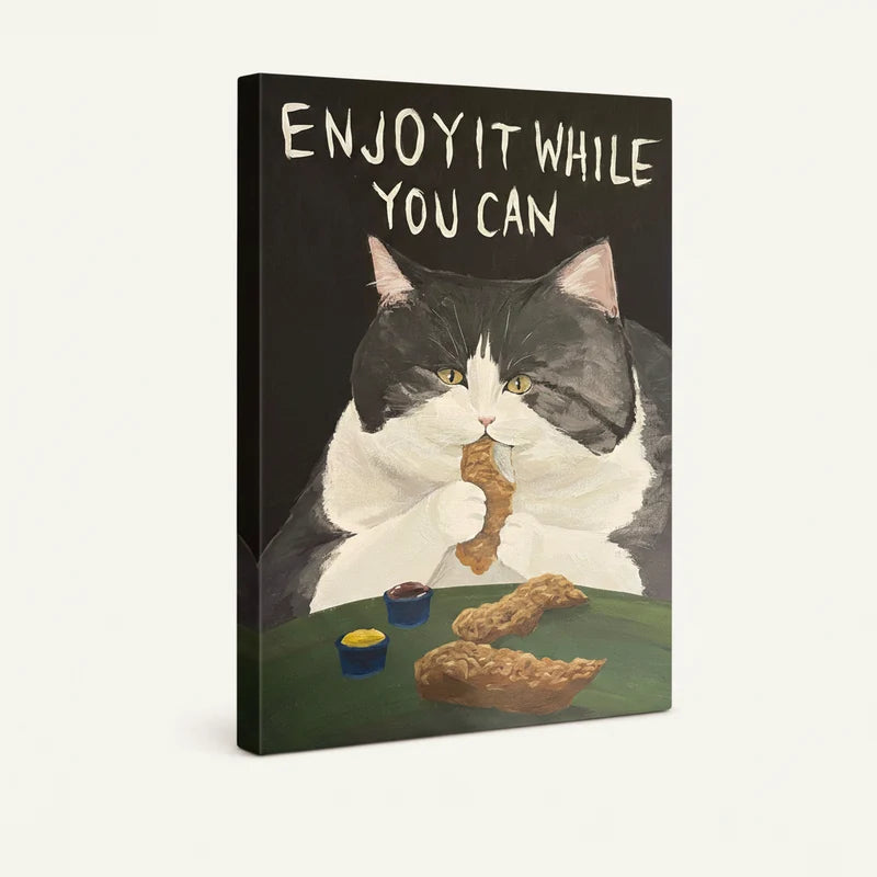 Gallery-wrapped canvas of tuxedo cat holding fried chicken with bold hand-lettered motivational text above
