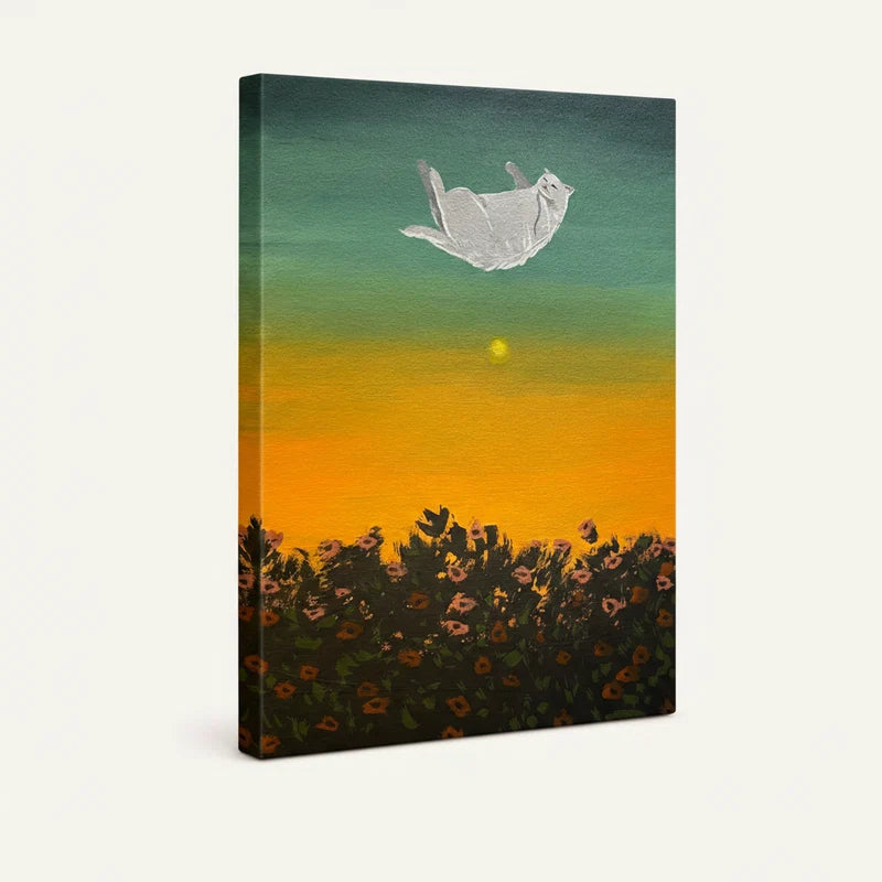 Gallery-wrapped canvas showing floating cat wall art with rich sunset gradient and wildflower field below
