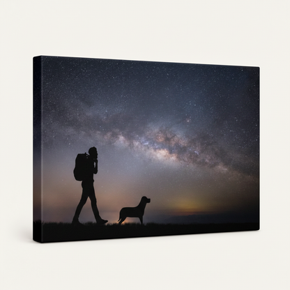 Gallery-wrapped night sky canvas showing hiker and dog under starry galaxy, angled view on white background