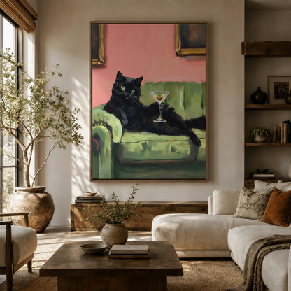 Large black cat martini canvas art in walnut float frame displayed in bright boho living room with olive tree