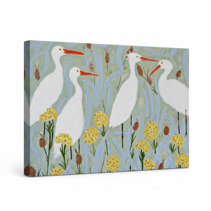 Gallery-wrapped egret botanical canvas print with dark painted edges, four white birds in reeds, angled view on white background