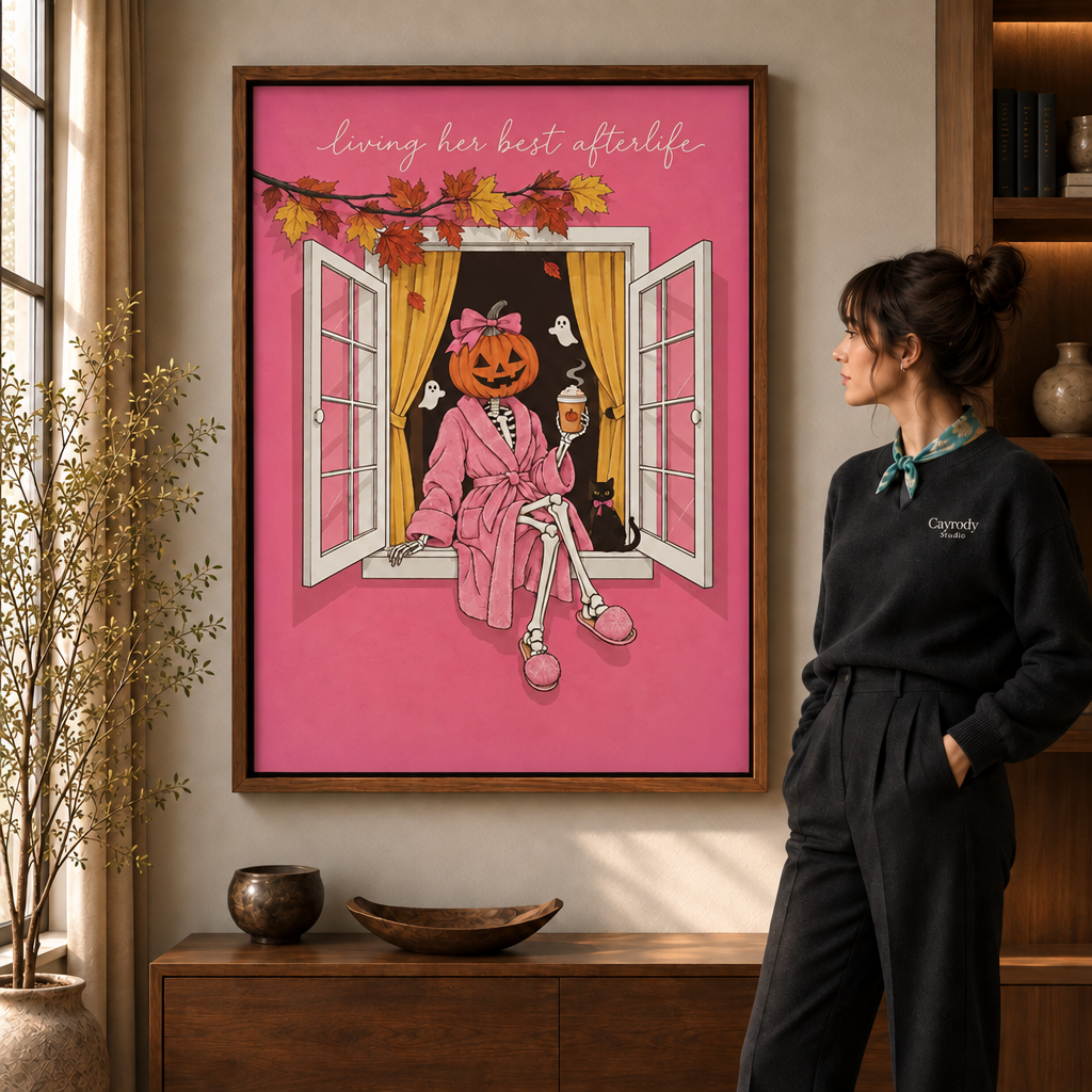 Pumpkin head skeleton in a pink robe canvas wall art in a walnut frame above a wood sideboard.