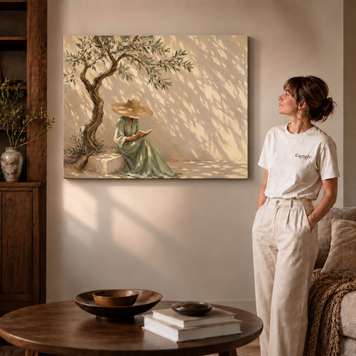 Olive tree reader canvas wall art shown on unframed gallery wrapped canvas beside a woman in white clothing.