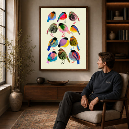 Colorful birds canvas art above a wooden console near a seated man and leafy branches.